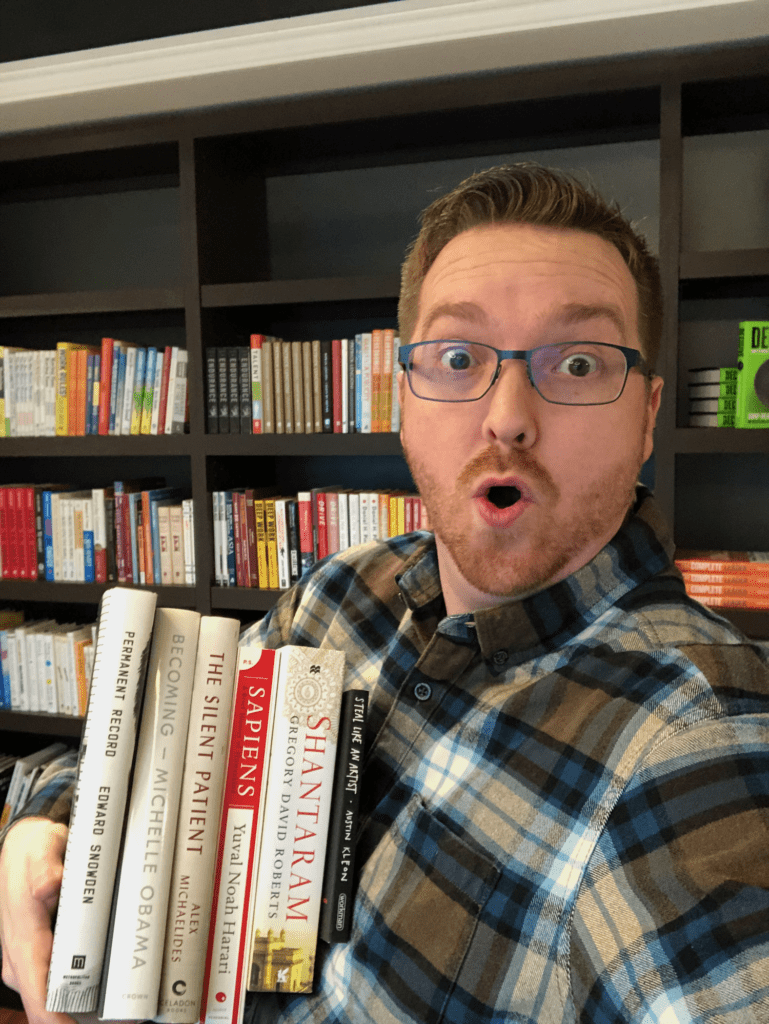 This dude is WAY too excited about his books. (And yes, that's me.)